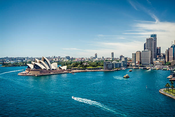 View of Sydney Harbour, Australia Sydney Opera House and Circular quay, ferry terminus, from the harbour bridge. australia stock pictures, royalty-free photos & images