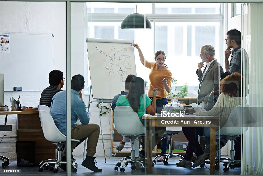 Giving her pitch to the crew Shot of businesspeople in deep discussion during a boardroom presentation http://195.154.178.81/DATA/istock_collage/0/shoots/784885.jpg 2015 Stock Photo