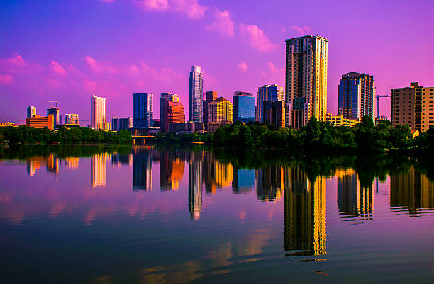 istock Wide Angle Pink Clouds Sunrise Austin Cityscape Reflection 535455851