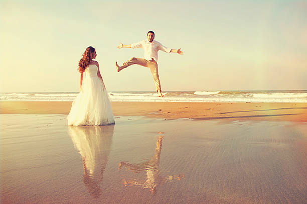 istock happy couple at beach 535457674