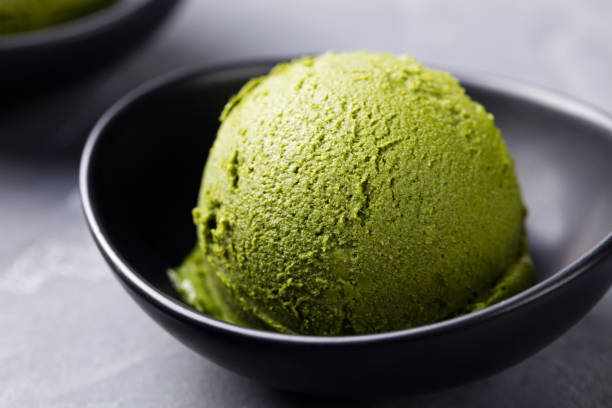 istock Green tea matcha ice cream scoop in bowl 535458638