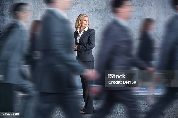 Businesswoman Turns Head To Look In Direction Pedestrians Are Walking Stock Photo - Download Image Now