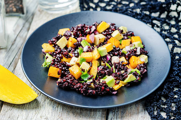 istock Mango avocado red onion black rice salad 535459292