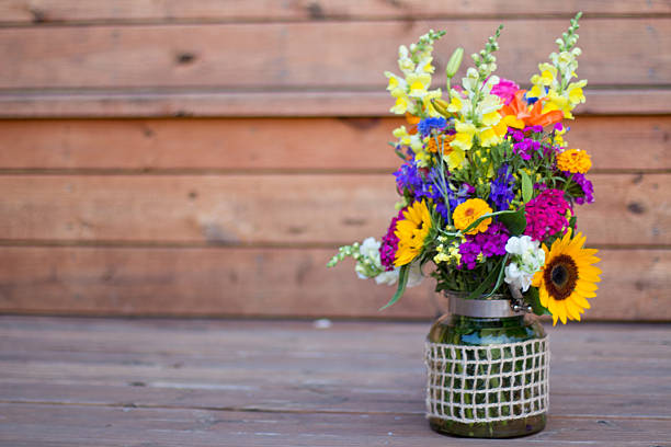 istock Bouquet flower arrangement on wood background with space for copy 535459430