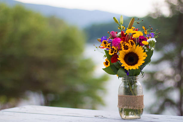 flower bouquet with mountains and trees bokeh in background