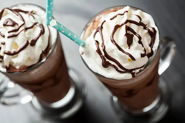 Refreshing iced coffe drink with whipped cream: freddoccino, frappuccino