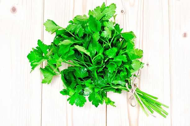 istock Fresh Parsley on a Wooden Boards 535459806