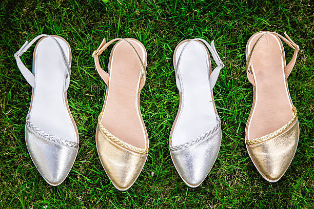 istock serebryan?e zolot?e and sandals on a green grass, advertising 535460612