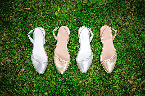 istock sandals on a green grass, advertising 535460790