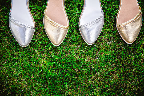 istock sandals on a green grass, advertising 535460958