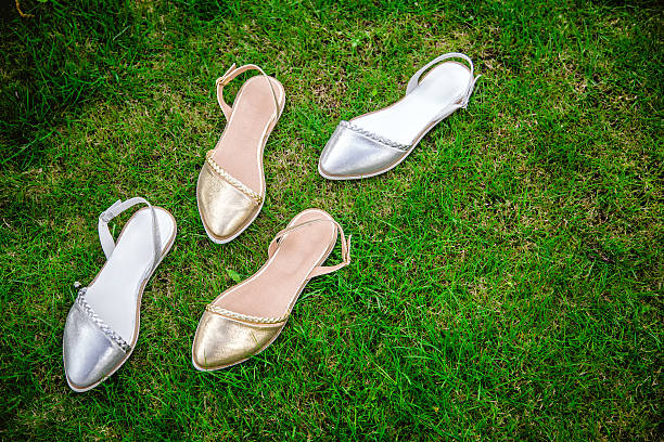 istock sandals on a green grass, advertising 535461172
