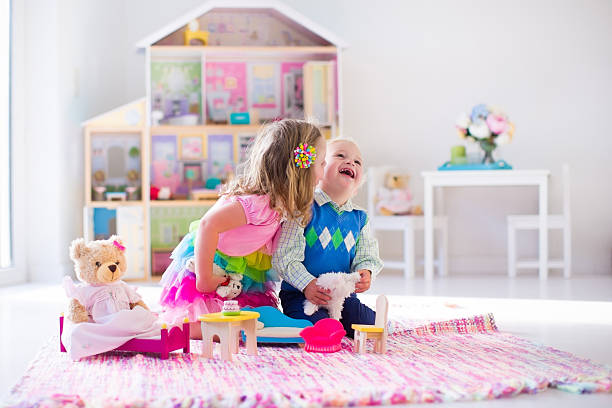 istock Funny kids playing with stuffed animals and doll house 535462722