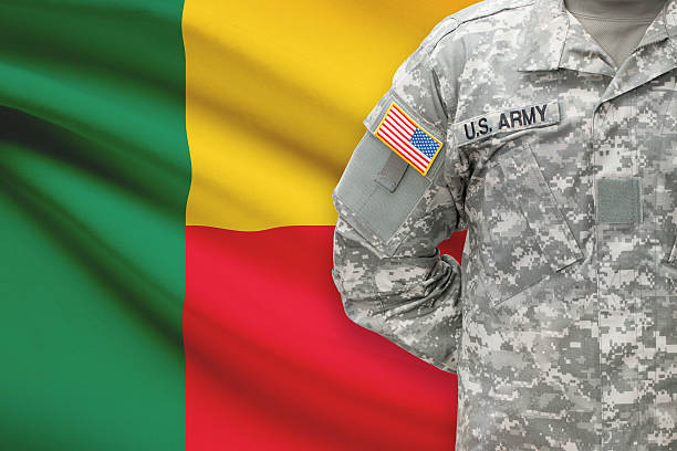 istock American soldier with flag on background - Benin 535463509