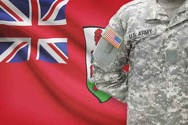 istock American soldier with flag on background - Bermuda 535463517