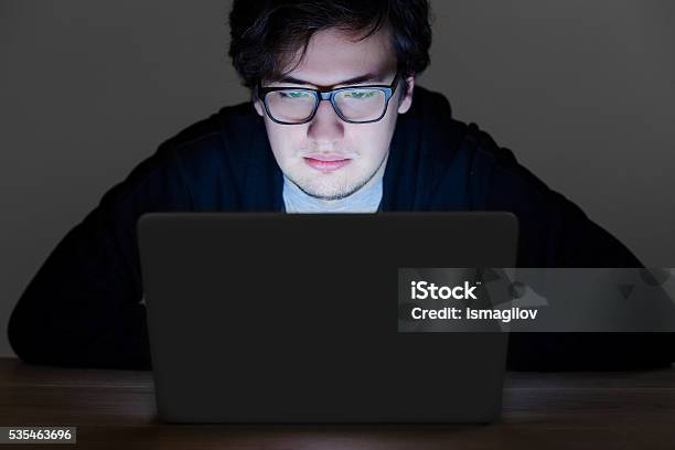Guy With Glasses Hacking Computer Stock Photo - Download Image Now - Adult, Burglar, Computer