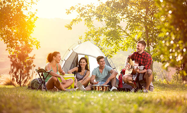 istock young friends have good time on camping trip 535464158