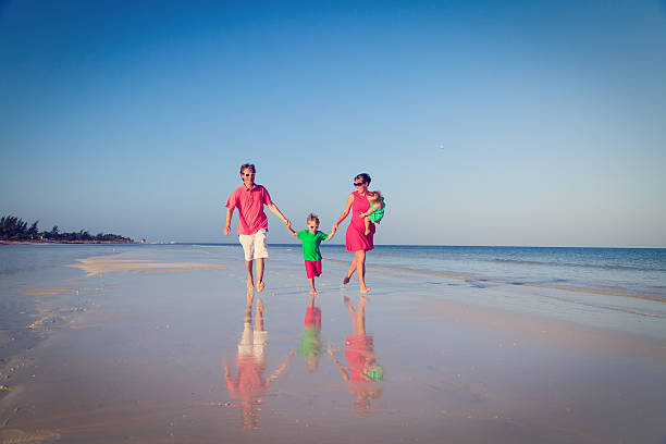 istock family with kids having fun on tropical beach 535464169