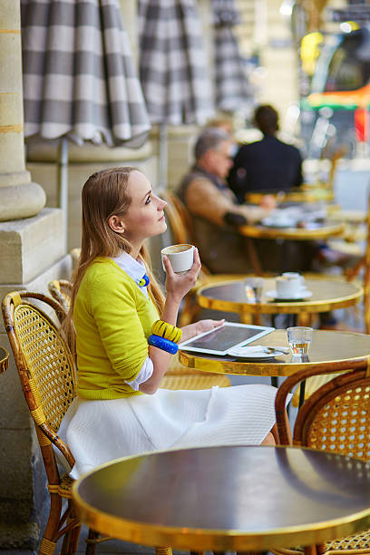 istock Young romantic Parisian girl drinking coffee 535464896
