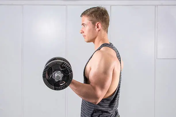 Photo of Man performing biceps workout