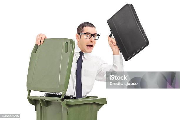 Terrified Businessman Hiding In A Trash Can Stock Photo - Download Image Now - 20-29 Years, 2015, Adult