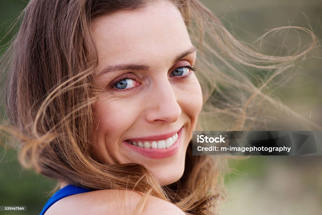 Healthy smiling woman outside Close up portrait of healthy smiling woman outside Summer Stock Photo