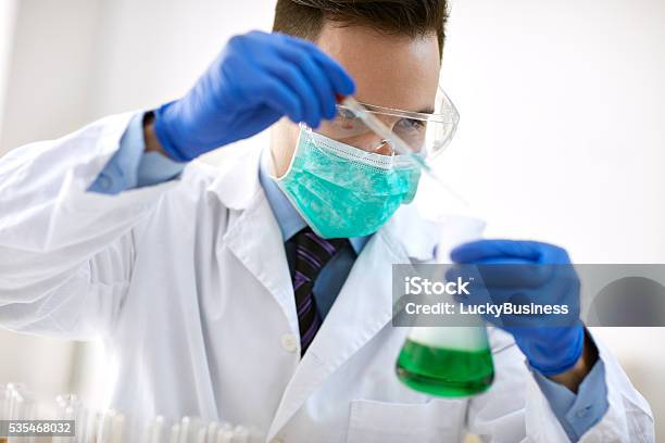 Medical Research Scientist In Laboratory Stock Photo - Download Image Now - Adult, Analyzing, Biology