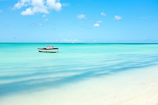 Little fishing boat in the caribbean sea on Aruba island stock photo