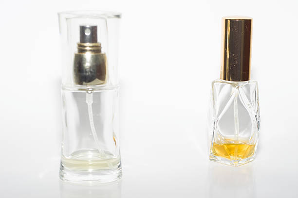 istock Two bottles of perfume on white background 535469187