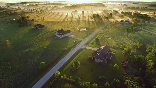 istock Magical sunrise through fog with long shadows and sunbeams 535469372