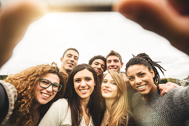istock Group of college student laughing and doing a selfie 535469831