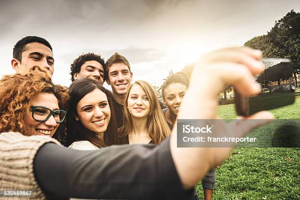 Group Of College Student Laughing And Doing A Selfie Stock Photo - Download Image Now