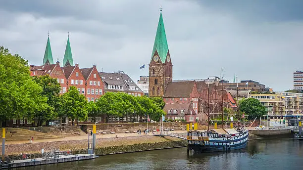 Historic town of Bremen with old sailing ship on Weser river, Germany