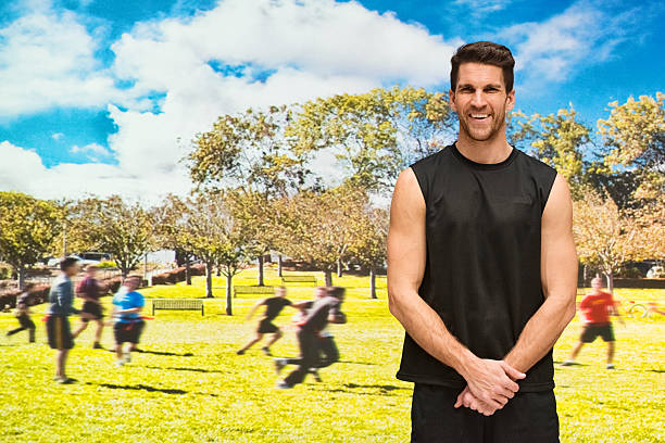 istock Smiling muscular man in front of field 535472400