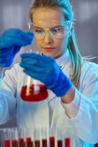 istock Serious female chemist working in laboratory 535472420