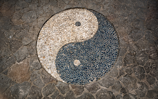 Yin Yang Symbol in mosaic stone floor