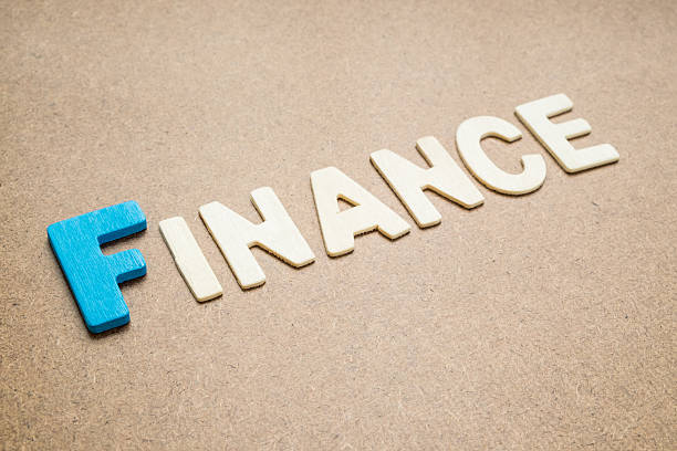 istock Text 'Finance' wording on brown background 535473462