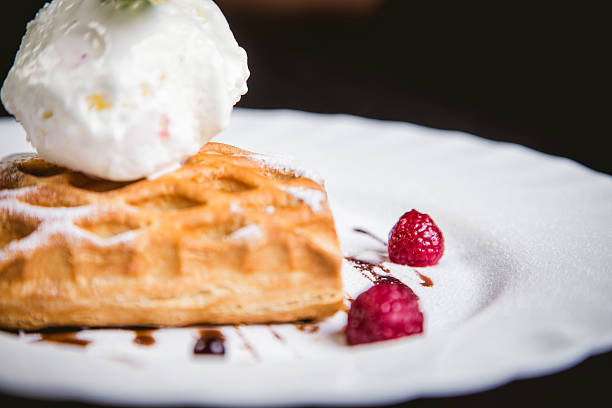 istock dessert cake with ice cream and raspberries 535474152