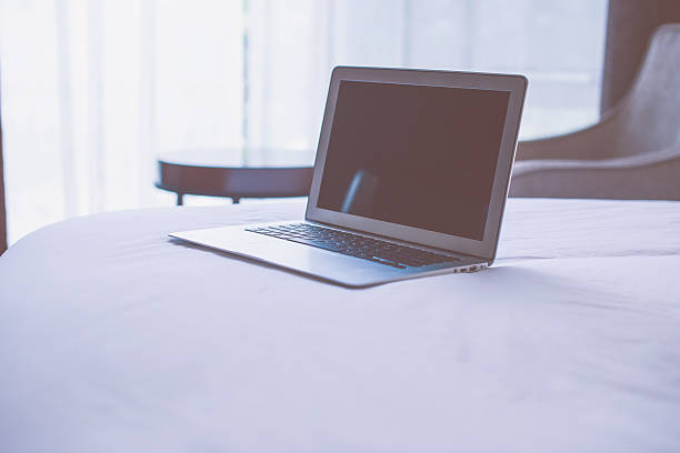 istock Laptop on Bed in Modern Bedroom 535474346