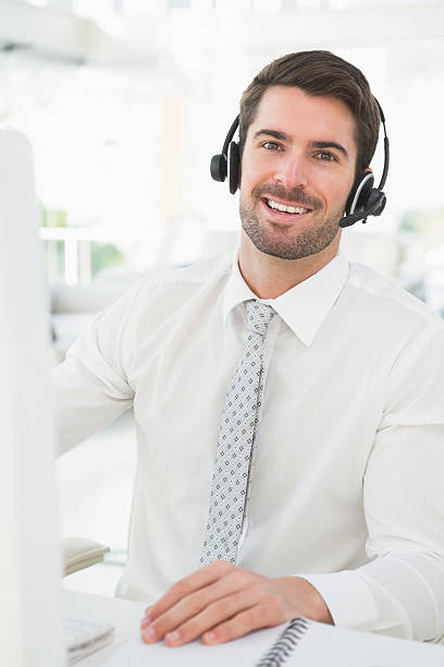 istock Happy businessman with headset interacting 535475619