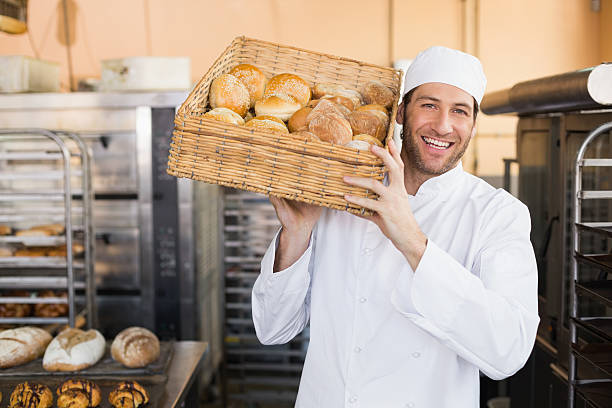 istock Baker holding basket of bread 535476103