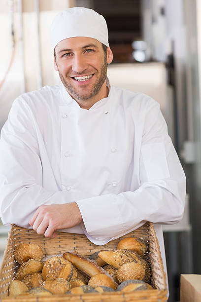 istock Happy baker with basket of bread 535476179