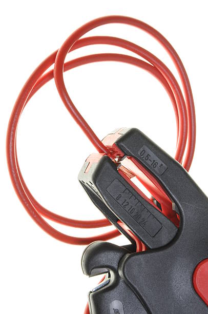 istock Cable cutters, stripping of red power cable 535476727