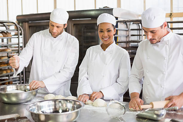 istock Team of bakers preparing dough 535476839