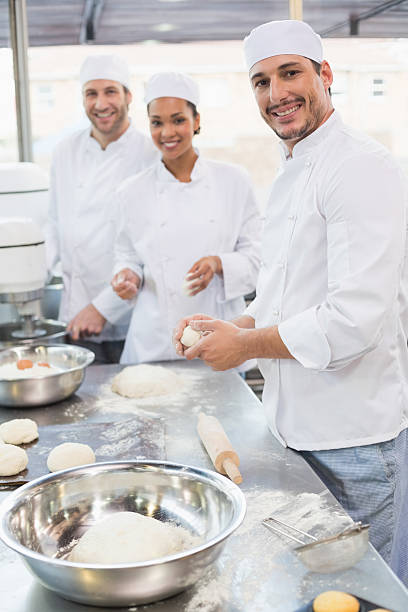 istock Team of bakers working at counter 535477217