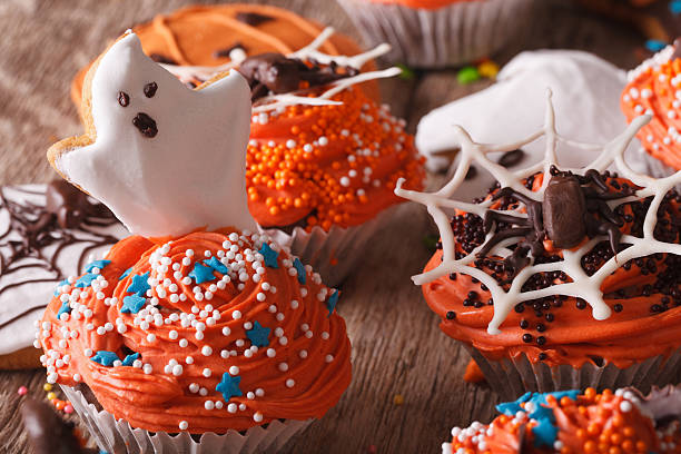 istock Halloween cupcakes with ghosts and spider close-up. horizontal 535477294