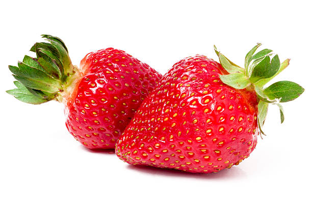 istock Two strawberries isolated on white background close-up macro 535477604