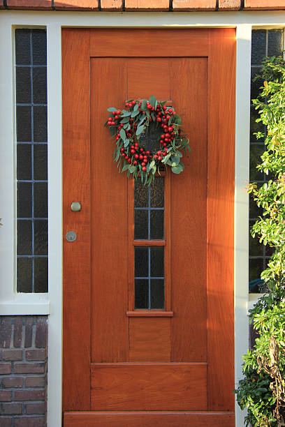 istock Berry christmas wreath with decorations on a door 535478130