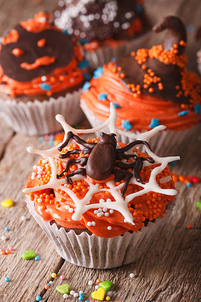 istock Halloween cupcakes decorated with chocolate spider, vertical 535478348