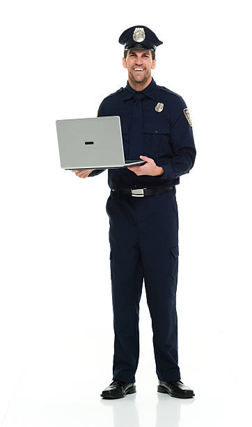 istock Smiling police holding laptop 535478426