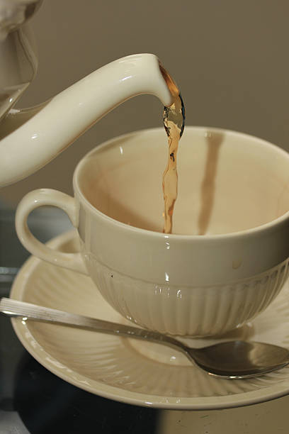 istock Pouring tea in a classic white teacup 535478644